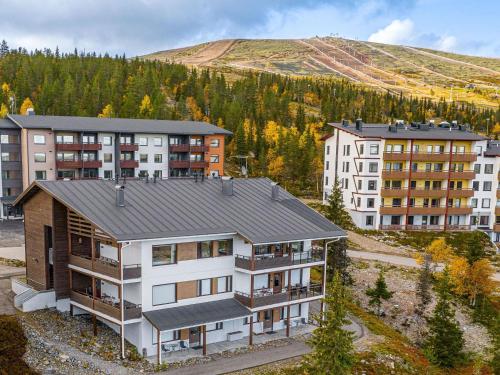 an aerial view of a apartment complex with buildings at Holiday Home Villa ylläs 203 by Interhome in Ylläs