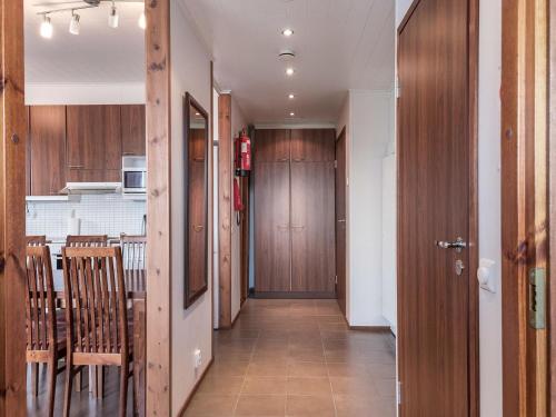 a hallway leading to a kitchen and a dining room at Holiday Home Villa ylläs 101 by Interhome in Ylläs