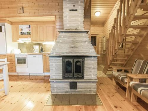 a kitchen with a stove in the middle of a room at Holiday Home Ylläsrova b5 - kasku by Interhome in Ylläsjärvi