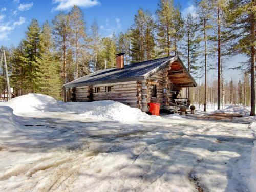 a log cabin in the woods in the snow at Holiday Home Hankisääski by Interhome in Ylläsjärvi