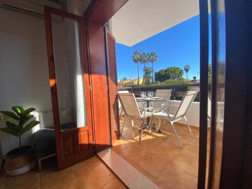 a room with a balcony with a table and chairs at Apartment with private balcony in San Javier