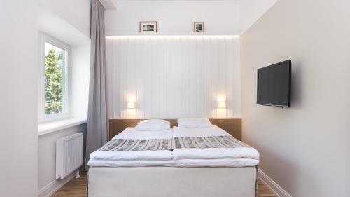 Una cama o camas en una habitación de Rannahotell