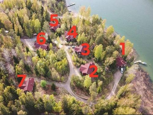 an aerial view of a house on an island in the water at Holiday Home Merimetso 6 by Interhome in Strandby