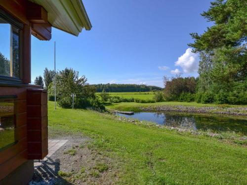 a view of a river from the side of a house at Holiday Home Kannelpirtti 1 by Interhome in Puromäki