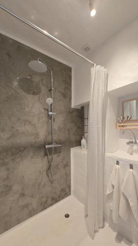 a bathroom with a shower and a sink at Casa do Castelo Terena in Alandroal