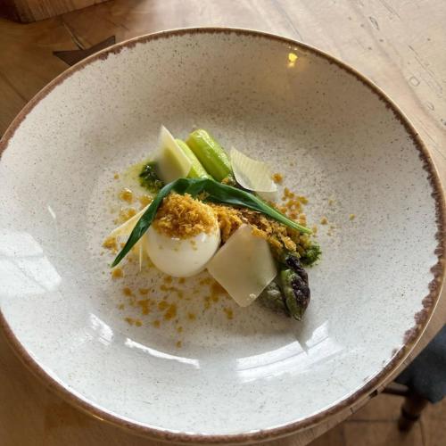 a plate of food with an egg and vegetables at Horse & Farrier Pub in Dacre