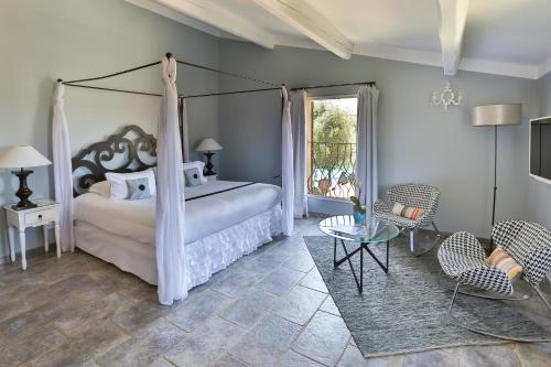 Katil atau katil-katil dalam bilik di Hôtel La Dimora & Spa