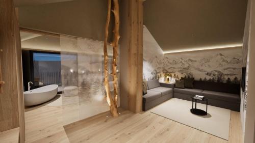 a bathroom with a couch and a tub in a room at Hotel Erica in Tesero