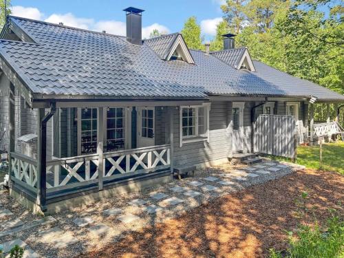 a house with a porch and a roof at Holiday Home Sini 2b by Interhome in Lahdenperä