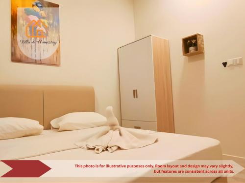 a bedroom with two beds and a mirror at ImpianKU MetaStay KL in Seri Kembangan