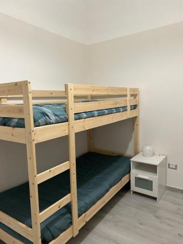 a couple of bunk beds in a room at Casa Nonna Etna in Linguaglossa