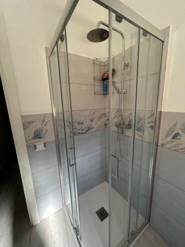 a shower with a glass door in a bathroom at Casa Nonna Etna in Linguaglossa