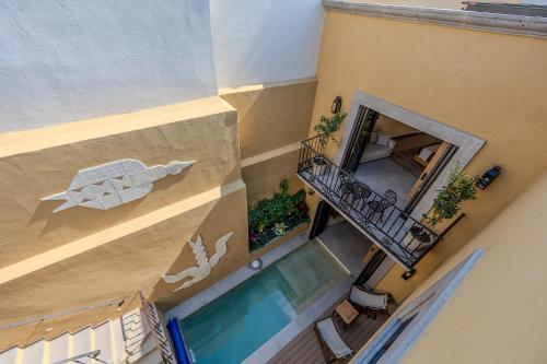 an overhead view of a house with a swimming pool at Designer Retreat in Centro Heated Pool & Views in San Miguel de Allende