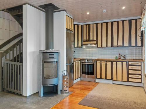 a large kitchen with a stove in a room at Holiday Home Kelkka 2 by Interhome in Salla