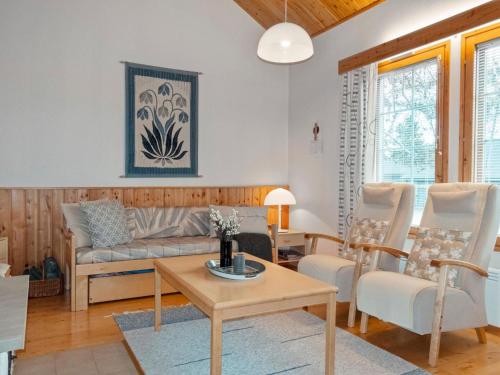 a living room with a couch and chairs at Holiday Home Siulapalkinen a 4 by Interhome in Saariselka