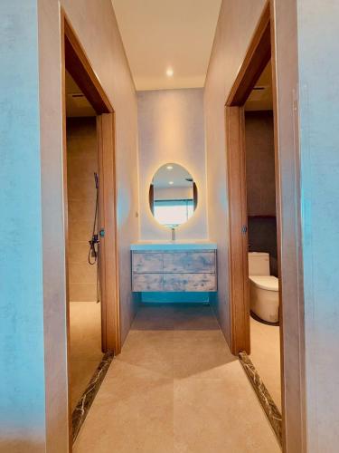 a bathroom with a sink and a mirror at Zenith Retreat in Xiaoliuqiu