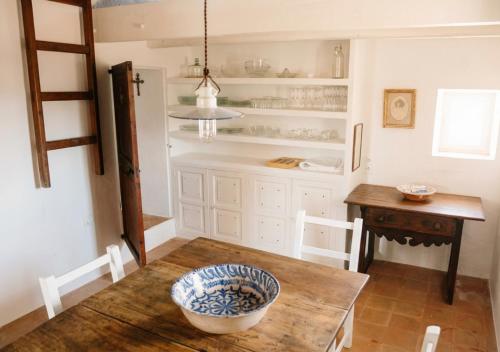 a kitchen with a table with a bowl on it at Can Toni Platera in Sant Francesc Xavier
