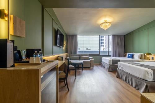 En eller flere senge i et værelse på Hotel Imperial Reforma