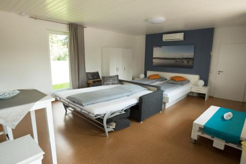 a bedroom with two beds in a room at Seeland Lodge in Hilpoltstein