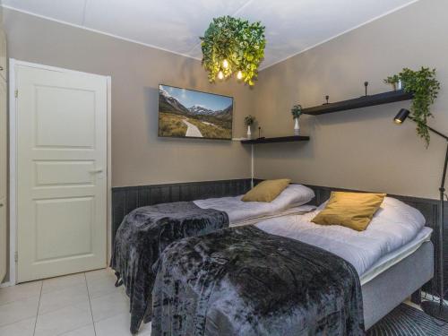 a room with two beds in a room at Holiday Home Levin mini by Interhome in Sirkka