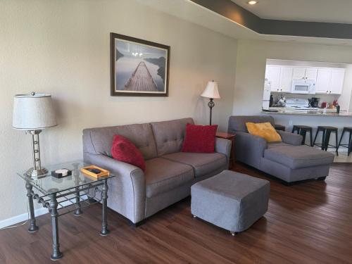 a living room with a couch and a table at Lake Ozarks Get Away in Lake Ozark