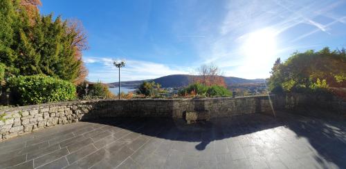 a stone retaining wall with a stone walkway at Ferienhaus am Rursee - Haus Eiche in Simmerath