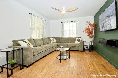 a living room with a couch and a table at Family Friendly 3 BR 2 BA Home near Navy Base in Waukegan