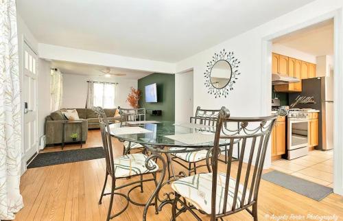 a kitchen and living room with a table and chairs at Family Friendly 3 BR 2 BA Home near Navy Base in Waukegan