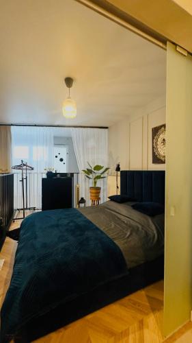a bedroom with a large bed in a room at Apartamenty Zamość Sienkiewicza in Zamość