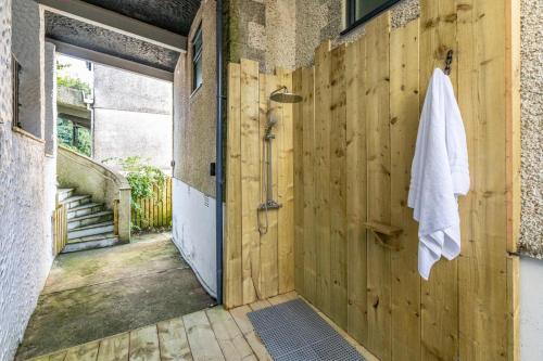a wooden door with a towel hanging on a wall at 4 Bed in Carbis Bay oc-m30075 in Carbis Bay