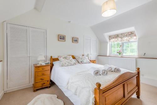a bedroom with a bed with two towels on it at 2 Bed in Yatton oc-s32603 in Leinthall Earls