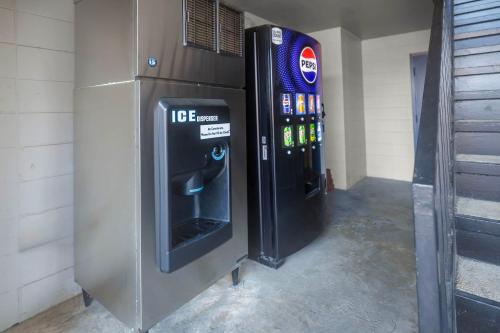 two vending machines are next to each other at Motel 6 Greenwood, MS in Greenwood