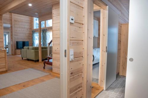 a wooden door in a room with a bedroom at Villa Siltasaari in Sotkamo