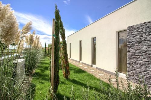 a house with a garden in front of it at Charming villa Darte with private pool near Rovinj, extra pool heating available in Kanfanar