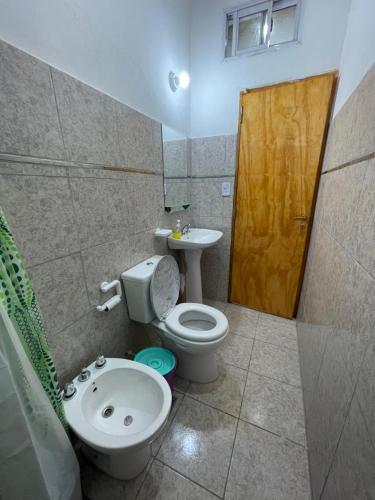 a bathroom with a toilet and a sink at Brian Cuello in San Rafael