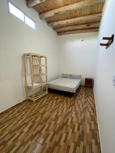 a room with a bed and a shelf in it at Brian Cuello in San Rafael