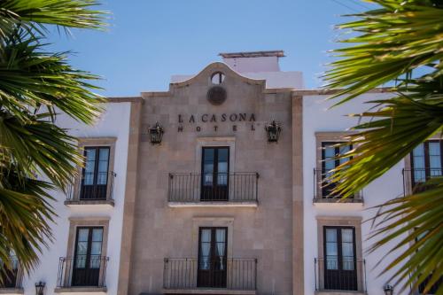a building with a sign that reads la coya at Hotel La Casona 30 in San Miguel de Allende