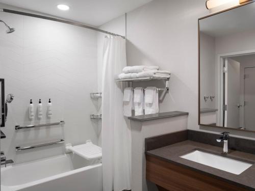a bathroom with a tub and a sink and a shower at TownePlace Suites by Marriott Corbin in Corbin