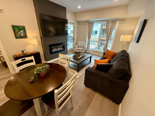 a living room with a table and a couch at Sparrowhawk Mountain Resort in Dead Man's Flats
