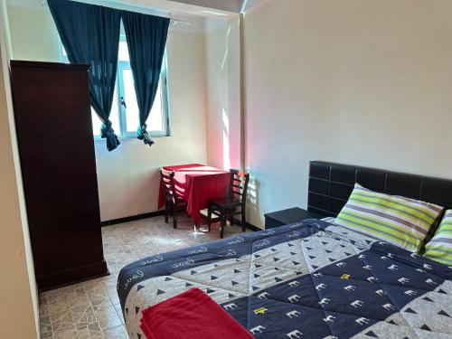 Llit o llits en una habitació de SafeLand