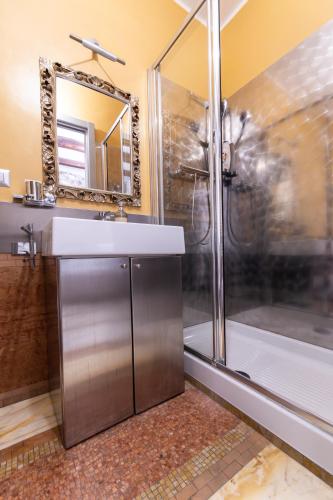 a bathroom with a sink and a shower at La Cantina del Convento in Potenza