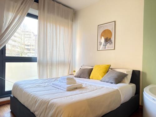 a bedroom with a large bed and a window at Luxury Studio con Private Jacuzzi, Spa Experience in Perugia