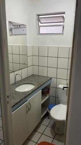 a bathroom with a sink and a toilet at Solares Residence in Teresina