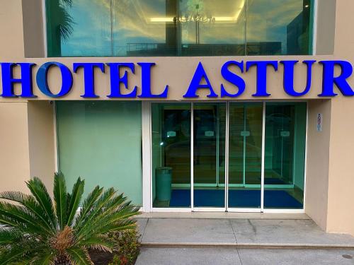 a hotel institute sign on the side of a building at Astur Hotel & Residence in Veracruz