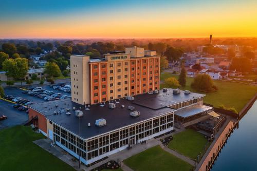 an aerial view of a building with a parking lot at Crowne Plaza Niagara Falls NY - Riverside by IHG in Niagara Falls