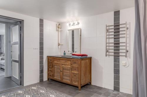 a bathroom with a sink and a mirror at Cosy stay in southern Malmo in Malmö