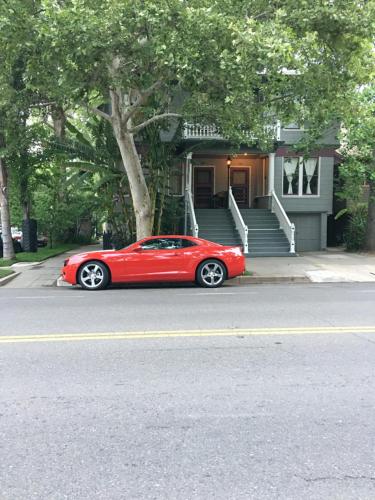 a red car parked in front of a house at Midtown Vibe in Sacramento