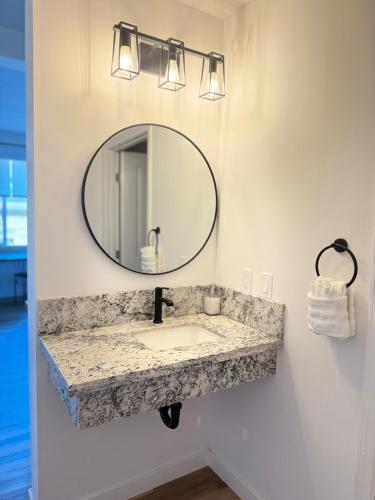 a bathroom with a sink and a mirror at Unit 3 Waena Inn Newly Renovated Maui Private Suite in Wailuku