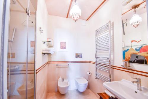 a bathroom with a toilet and a sink at B&B Al Convento in Potenza