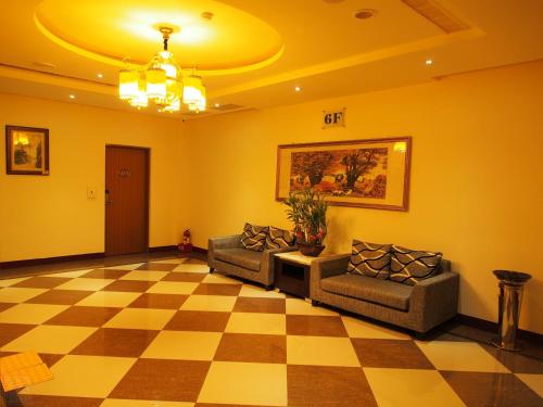 Zona de estar de Zheng Yi Classic Hotel & Motel